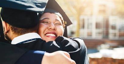 two-graduates-hugging