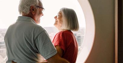 happy-older-couple-smiling-at-eachother